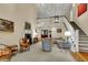 Bright living room featuring a fireplace, high ceilings, and ample natural light at 202 Needlerush Rd, Kiawah Island, SC 29455