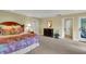 Spacious bedroom with king-size bed and access to private deck at 202 Needlerush Rd, Kiawah Island, SC 29455
