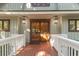 Inviting front entrance with double doors and a wood deck at 202 Needlerush Rd, Kiawah Island, SC 29455