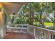 Deck overlooking a golf course with lush green trees and a white bench at 202 Needlerush Rd, Kiawah Island, SC 29455
