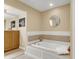 Relaxing bathroom with a large corner jacuzzi tub and double vanity at 202 Needlerush Rd, Kiawah Island, SC 29455