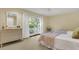 Bedroom with two twin beds, dresser, and sliding glass doors leading to a deck at 202 Needlerush Rd, Kiawah Island, SC 29455