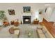 Living room with a fireplace, hardwood floors, and comfortable seating at 202 Needlerush Rd, Kiawah Island, SC 29455