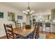 Dining area with hardwood floors and a large wooden table at 202 Needlerush Rd, Kiawah Island, SC 29455