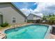 Inviting backyard pool with surrounding patio at 166 Blackstone Dr, Moncks Corner, SC 29461
