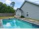 Inviting backyard pool with spacious patio area and privacy fence at 166 Blackstone Dr, Moncks Corner, SC 29461
