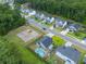 Aerial view of neighborhood with homes, playground, and pool at 166 Blackstone Dr, Moncks Corner, SC 29461