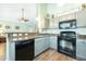 Modern kitchen with granite countertops and stainless steel appliances at 166 Blackstone Dr, Moncks Corner, SC 29461