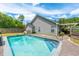 Inviting in-ground pool with concrete decking and fenced backyard at 166 Blackstone Dr, Moncks Corner, SC 29461
