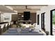 Open concept living room and kitchen with modern fireplace at 211 Seven Farms Dr # 302, Charleston, SC 29492
