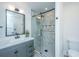 Contemporary bathroom with gray vanity, marble shower, and modern fixtures at 3820 Gardenhill Rd, Mount Pleasant, SC 29429
