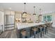 Modern kitchen with white cabinets and a large island at 3820 Gardenhill Rd, Mount Pleasant, SC 29429