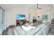 Spacious living room with sectional sofa, wood floors, and a large TV at 3820 Gardenhill Rd, Mount Pleasant, SC 29429