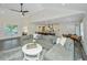 Open living space with a large sectional sofa, coffee table, and adjacent kitchen at 3820 Gardenhill Rd, Mount Pleasant, SC 29429