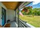 Front porch features a hanging planter, American flag and door wreath at 3820 Gardenhill Rd, Mount Pleasant, SC 29429