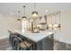 Modern kitchen with white cabinets, marble countertops, and large island at 3820 Gardenhill Rd, Mount Pleasant, SC 29429