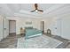 Spacious bedroom with wood floors, ceiling fan, and ample natural light at 3820 Gardenhill Rd, Mount Pleasant, SC 29429