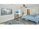 Cozy bedroom with wood floors, a comfy chair, and built-in shelving at 3820 Gardenhill Rd, Mount Pleasant, SC 29429