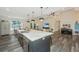 Open kitchen boasts a large island with quartz countertops and stainless steel appliances at 3820 Gardenhill Rd, Mount Pleasant, SC 29429