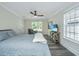 Relaxing bedroom with large bed, ceiling fan, and wood-look floors at 3820 Gardenhill Rd, Mount Pleasant, SC 29429
