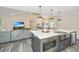 Modern kitchen with a large island, stainless steel appliances, and white quartz countertops at 3820 Gardenhill Rd, Mount Pleasant, SC 29429
