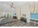Open living area with large sectional sofa, TV, and high ceilings at 3820 Gardenhill Rd, Mount Pleasant, SC 29429