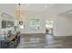 Spacious entryway with decorative console table, wood floors, and natural light at 3820 Gardenhill Rd, Mount Pleasant, SC 29429