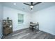Bright home office features a desk, window with blinds, and wood-look flooring at 3820 Gardenhill Rd, Mount Pleasant, SC 29429