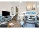 Bright living room with hardwood floors, comfy seating, and a large flat-screen TV at 1720 Live Oak Park, Seabrook Island, SC 29455