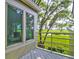 Deck overlooking peaceful marsh views with railing and trees at 1720 Live Oak Park, Seabrook Island, SC 29455