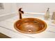 Close-up of copper sink with fish detailing in a bathroom at 1720 Live Oak Park, Seabrook Island, SC 29455