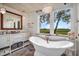 Charming bathroom with a freestanding bathtub and shiplap walls at 1720 Live Oak Park, Seabrook Island, SC 29455