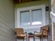 Cozy patio with two chairs and a small table, adjacent to a window at 1720 Live Oak Park, Seabrook Island, SC 29455