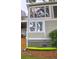 Green kayak rests against the side of a light taupe house at 1720 Live Oak Park, Seabrook Island, SC 29455