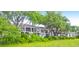 Row of houses nestled amongst lush trees near a marsh at 1720 Live Oak Park, Seabrook Island, SC 29455