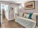 Bedroom with daybed, hardwood floors, and access to hallway and stairs at 1720 Live Oak Park, Seabrook Island, SC 29455