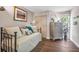 Bedroom with daybed, dresser, and hardwood floors, offering a tranquil atmosphere at 1720 Live Oak Park, Seabrook Island, SC 29455