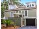 Townhouse with attached garage and lush landscaping at 1720 Live Oak Park, Seabrook Island, SC 29455