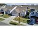 Gray house with white garage door and landscaping in a neighborhood at 253 River Martin Ct, Summerville, SC 29483