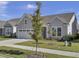 Gray Craftsman style home with a two-car garage and landscaping at 253 River Martin Ct, Summerville, SC 29483