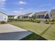Landscaped backyard with homes and fence at 253 River Martin Ct, Summerville, SC 29483