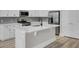 White kitchen island with quartz countertop and farmhouse sink at 253 River Martin Ct, Summerville, SC 29483
