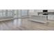 Living room with hardwood floors and access to sunroom at 253 River Martin Ct, Summerville, SC 29483