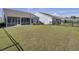 Large backyard with grassy area and homes at 253 River Martin Ct, Summerville, SC 29483