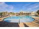 Resort-style pool with expansive sundeck and clubhouse in background at 253 River Martin Ct, Summerville, SC 29483