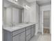 Elegant bathroom with double vanity and quartz countertop at 253 River Martin Ct, Summerville, SC 29483