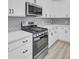 Stainless steel range and oven with white shaker cabinets at 253 River Martin Ct, Summerville, SC 29483