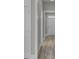 View down hallway featuring light walls, white trim, and wood flooring at 253 River Martin Ct, Summerville, SC 29483