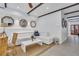 Open living room with white sectional sofa and dining area at 40 Morris St, Charleston, SC 29403
