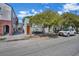 House located on a tree-lined street with neighboring houses visible at 40 Morris St, Charleston, SC 29403
